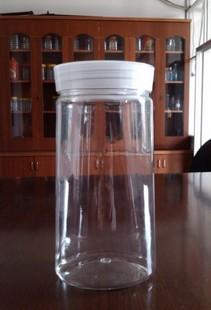 供应500K圆口扁底蜂蜜瓶透明塑料糖果罐